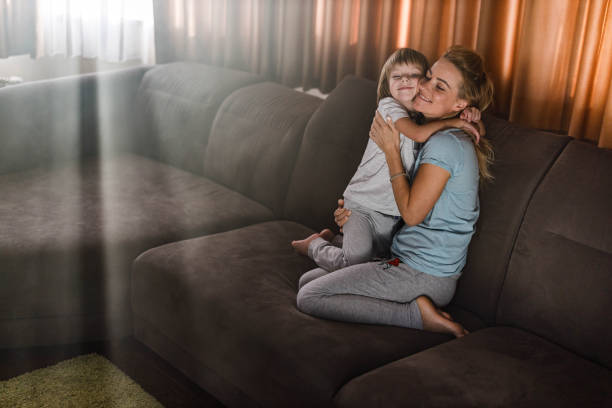 istock Loving single mother and son embracing at home. 1259783382