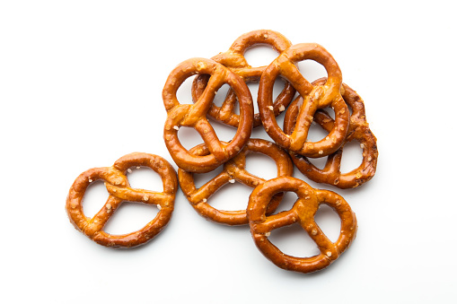 Freshly Baked Brown and Salty Pretzels on a white background