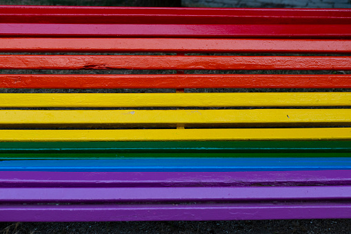Park bench in Betanzos coas cores de LGBT, Galicia, Spain
