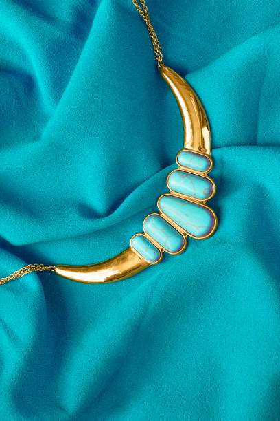 istock Necklace and blue silk 1259804171