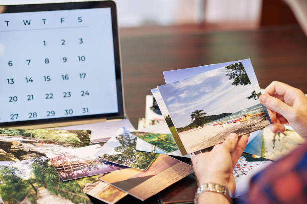 istock Traveler checking printed photos 1259812869