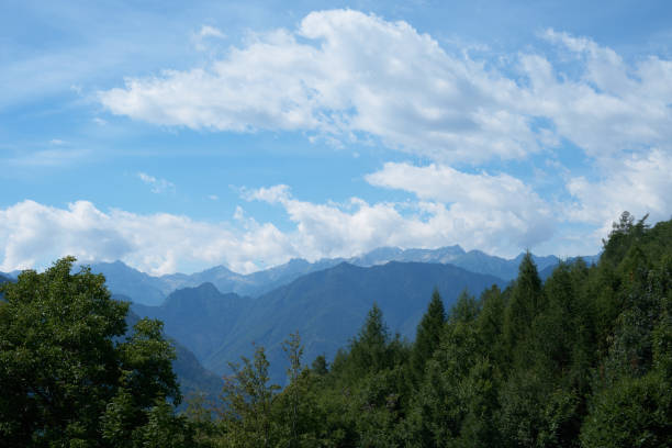 Free Stock Photo of A mountain range with trees and clouds | Download ...
