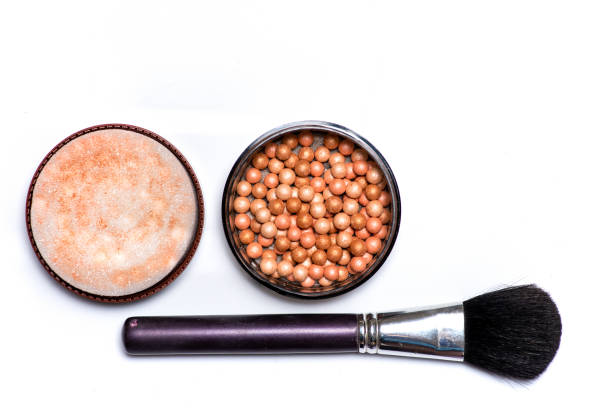 Makeup blush and balls with brush on white background isolated