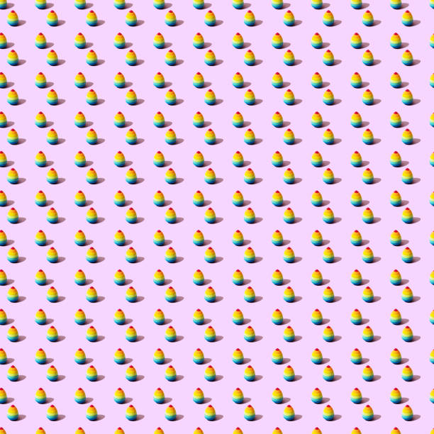 istock Multi-colored sponge for applying makeup, foundation, bb cream for make-up artist. Women's bright beauty accessory on pink background with a shadow. Pop art photo, trendy seamless pattern 1259816840