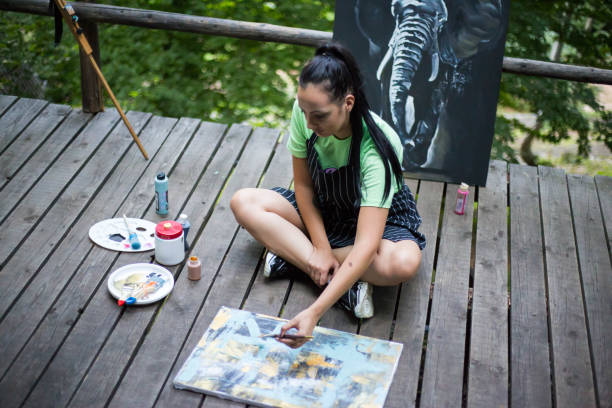 istock Beautiful fine art painter painting in nature 1259829694