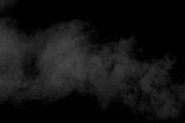 istock White smoke on a black background. The texture of scattered smoke. Blank for design. Layout for collages. 1259844564