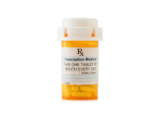 pill bottle - vitamin pill vitamin e isolated text imagens e fotografias de stock