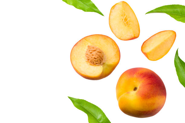 istock peach fruits with green leaf and slices isolated on white background. top view 1259860562