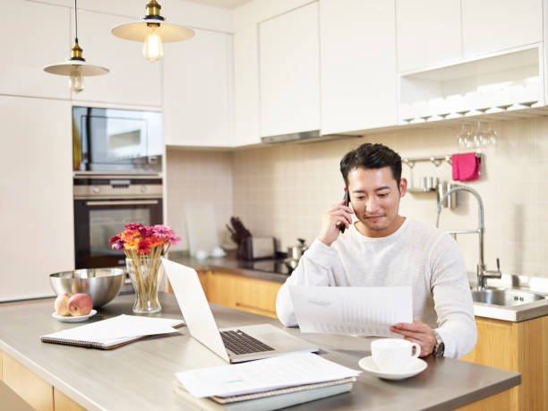 istock young asian business man working at home 1259864309