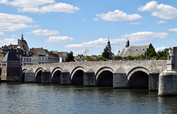istock Old stone Sint Servaas bridge over the river Maas in Maastricht 1259881547