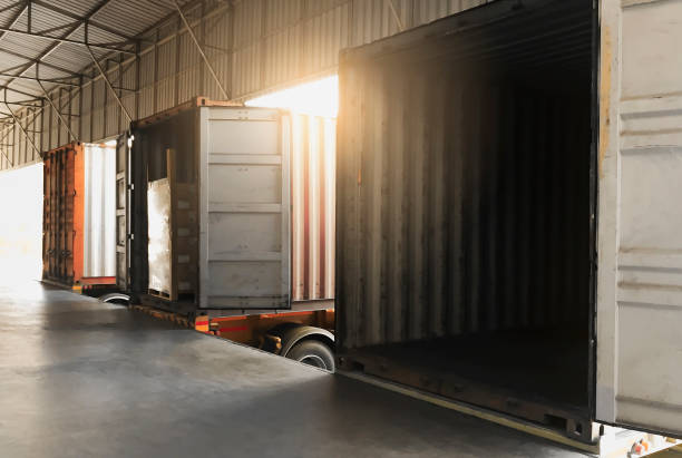 istock Truck container docking warehouse load cargo shipment at distribution warehouse, 1259887406