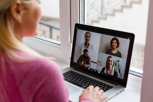 istock Woman Working From Home Having Group Videoconference On Laptop 1259888477
