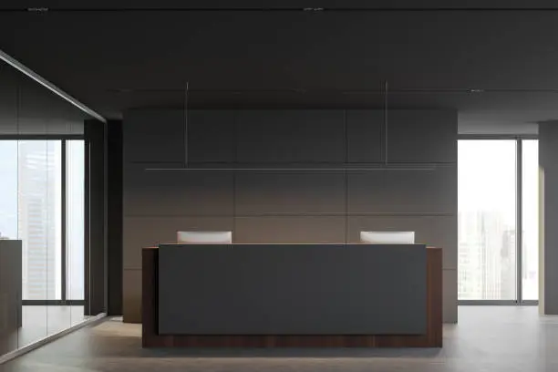 Photo of Grey and wooden reception desk in office interior