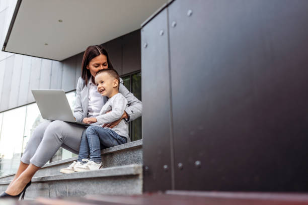 istock Mother with son working outdoors 1259891201