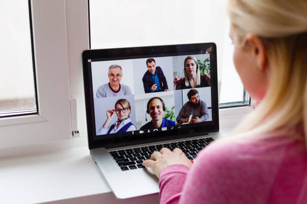 istock Woman Working From Home Having Group Videoconference On Laptop 1259892812