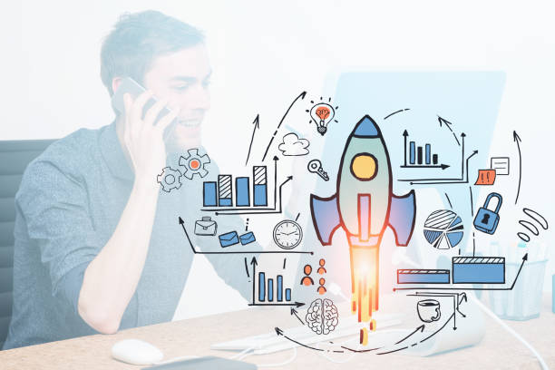 istock Smiling man on phone in office, startup project 1259899269