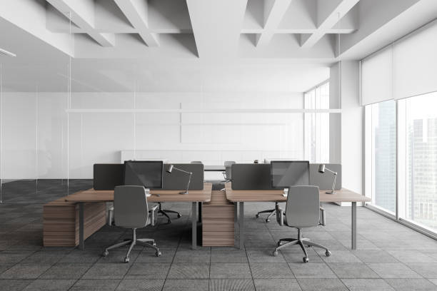 istock Grey and white open space office with meeting room 1259899814