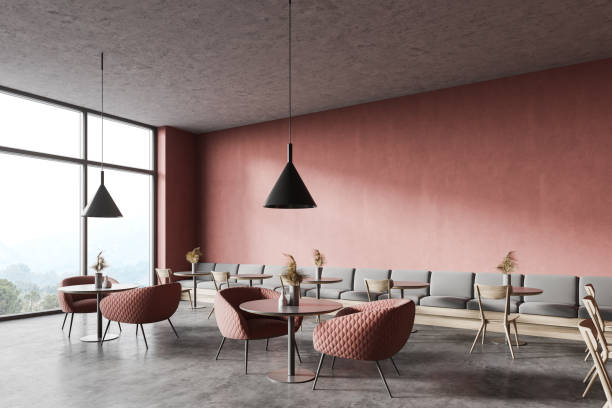 Pink coffee shop corner with sofa and armchairs