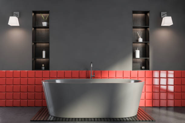 istock Grey and red tile bathroom interior with tub 1259905311