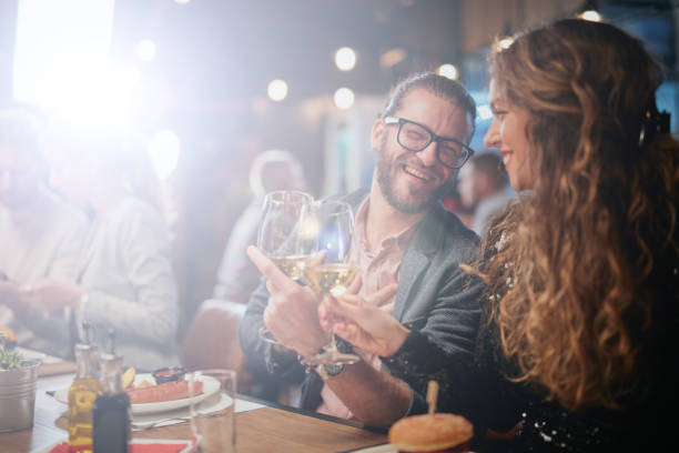 istock Group of friends having fun at restaurant. 1259911989