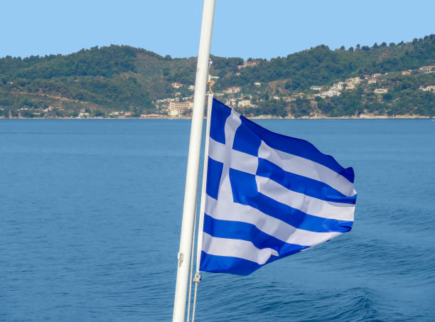 istock coastal scenery with greece flag 1259936445