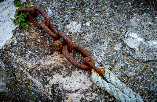 Chain and rope on a dockside in Polperro, Cornwall.