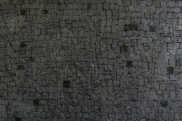 istock Rough texture of black granite tiles 1259941994