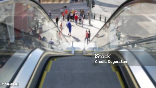 Perspective View Thru Escalator Defocused Unrecognizable Group Of People On Road Intersection Crosswalk On Strip Of Las Vegas Usa Anonymous Blurred Pedestrians On Walkway In Crowded Urban Downtown Stock Photo - Download Image Now