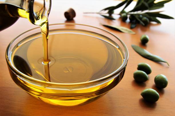 Pouring olive oil stock photo