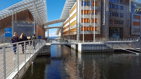 Oslo - Norway, April, 26. 2018 - Museum of modern art - Astrup Fearnley Museet. The building of wood and modern forms in the Oslo fjord. Visitors, tourists and locals enjoy the walk around the museum and the shore