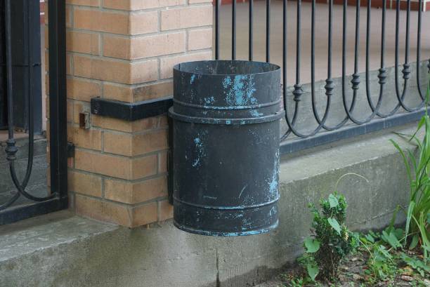 istock gray metal urn hanging on a brown brick wall outside 1259963336