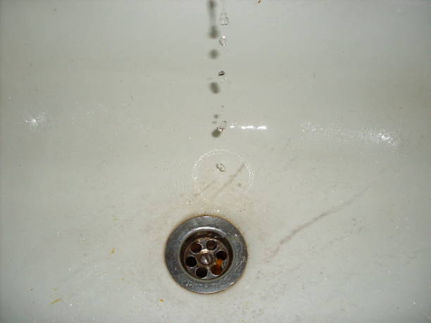 istock Water drops slowly fall into the sink 1259974623