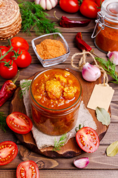 istock Canned cauliflower with vegetables in tomato sauce 1259983184