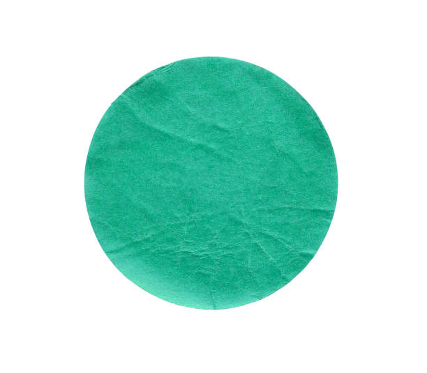 istock Blank green round adhesive paper sticker label isolated on white background 1259989199