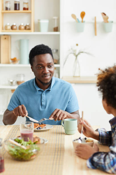 istock Family of two having breakfast 1259997335
