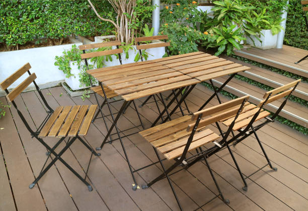 istock Empty Wooden Table and Chairs on the Garden Terrace 1260032667