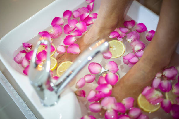Foot treatment and massage in a beauty salon - Feet spa treatment