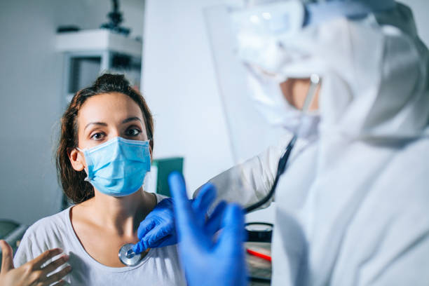 istock Doctor using stethoscope listening patients breathing 1260058707