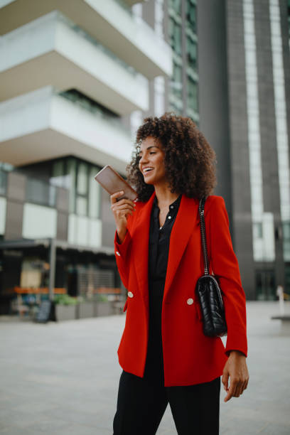 istock Businesswoman recording voice message using her smartphone 1260061004