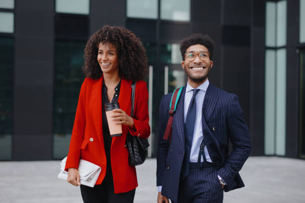 istock Two coworkers having a discussion while walking in the city 1260073931