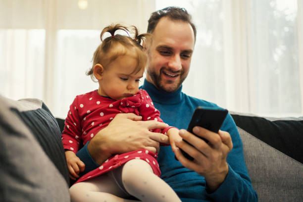 istock Father and daughter taking selfie 1260086473
