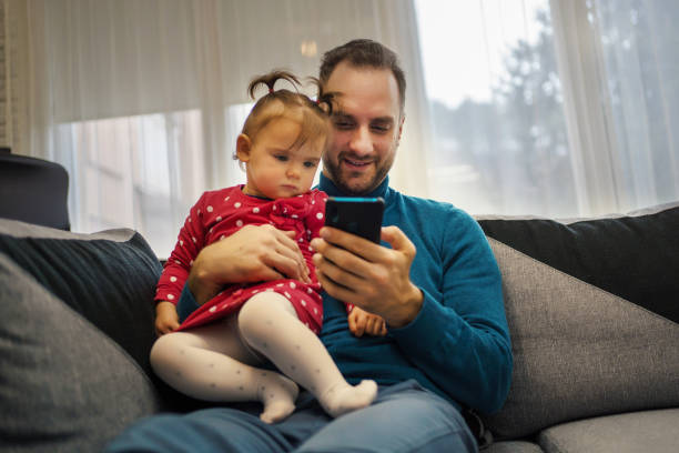 istock Father and daughter enjoying at home 1260089338