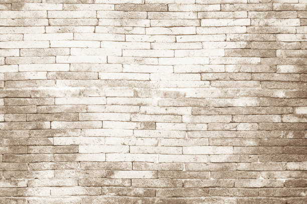 istock Empty Background of wide cream brick wall texture. Old brown bri 1260106527