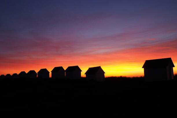 istock Small seaside houses at sunset 1260107580