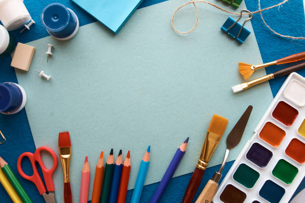 istock Art materials, products for drawing. Stationery set on blue background 1260110228