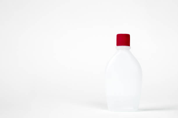 istock Bottle with red cap isolated on white background. 1260117134