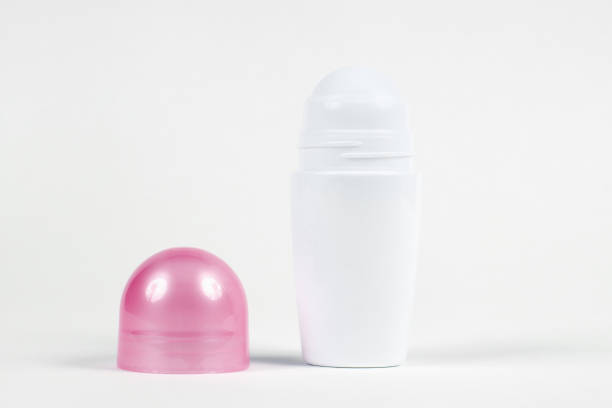 Pink Deodorant against white background with copy space. Deodorant with pink cap against white background with copy space. medicine bottle top view stock pictures, royalty-free photos & images