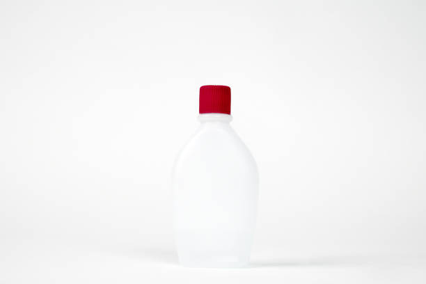 Bottle with red cap isolated on white background.