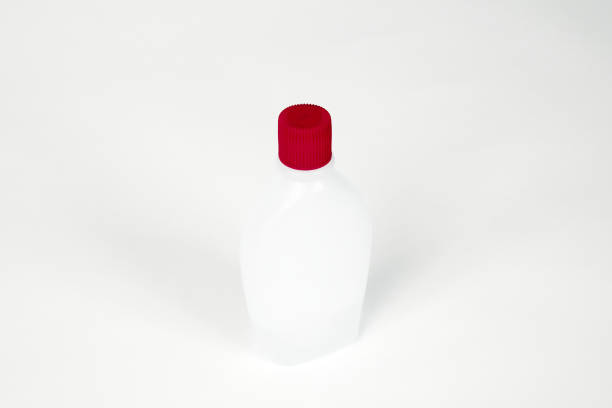 istock Bottle with red cap isolated on white background. 1260117782