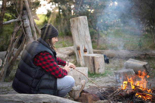 istock Australian Teenager Camping by the Fire 1260126067